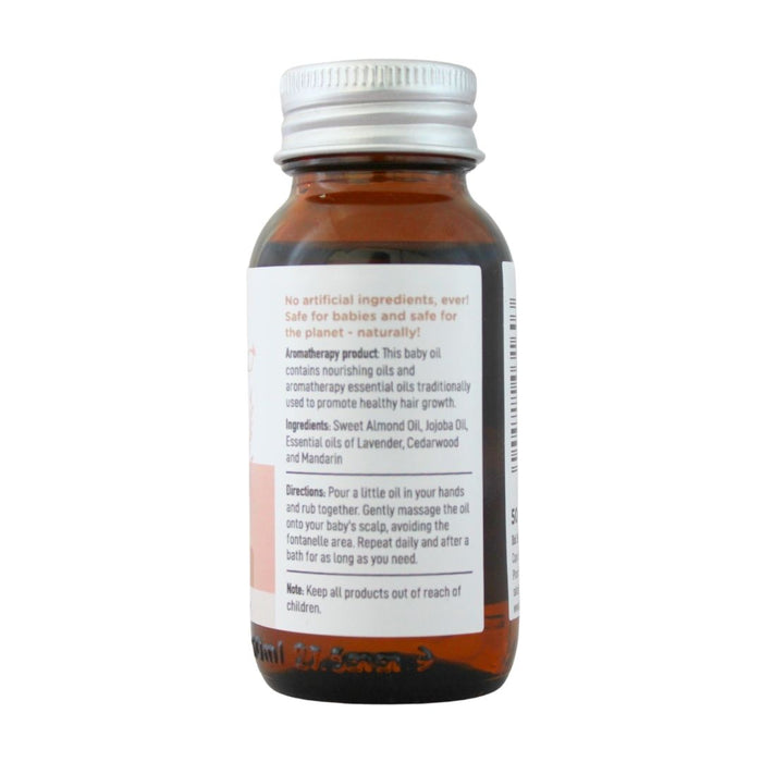 Wholesale BabyNature Baby Hair Oil Bottle showing ingredients, directions, and claims that it contains no artificial ingredients and is safe for babies.