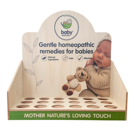 BabyNature countertop display stand for homeopathic baby remedies, featuring natural wood design, baby image, and product slots for bottles.